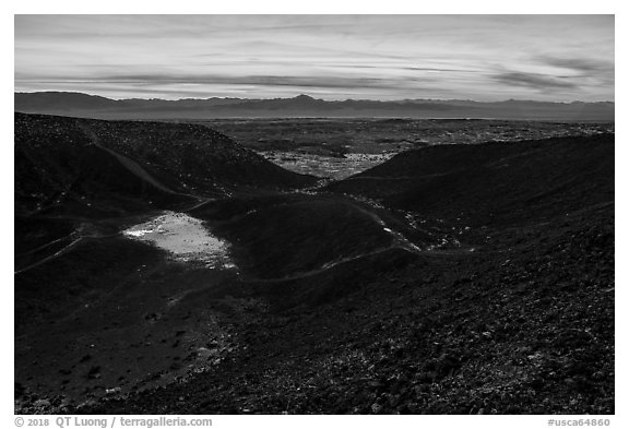 Interior of Amboy Crater with breach in the cinder cone rim at sunset. Mojave Trails National Monument, California, USA (black and white)