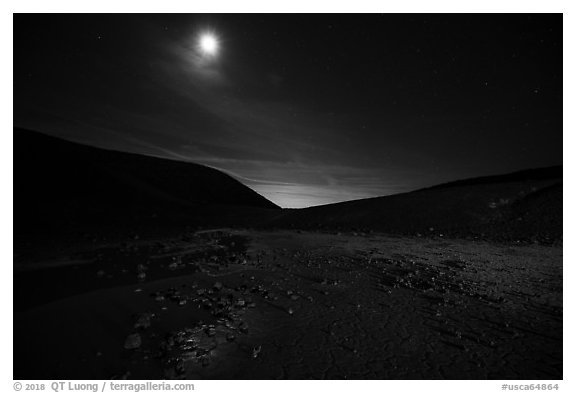Moon shining inside Amboy Crater at night. Mojave Trails National Monument, California, USA (black and white)
