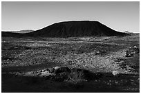 Lava field and Amboy Crater cinder cone. Mojave Trails National Monument, California, USA ( black and white)