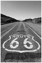 National Trails Highway (Route 66) marker and mountains. Mojave Trails National Monument, California, USA ( black and white)