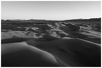 Aerial view of Cadiz dunes and mountains at sunset. Mojave Trails National Monument, California, USA ( black and white)