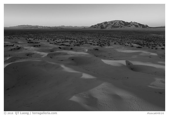 Aerial view of Cadiz dunes and mountain at sunset. Mojave Trails National Monument, California, USA (black and white)