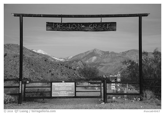 Entrance gate at dawn, Mission Creek Preserve. Sand to Snow National Monument, California, USA (black and white)