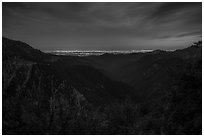 Mountains and distant Los Angeles Basin at night. San Gabriel Mountains National Monument, California, USA ( black and white)