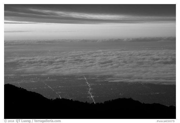 Low clouds above Los Angeles at sunrise from Mount Wilson. Los Angeles, California, USA (black and white)
