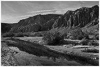 Afton Canyon cliffs reflected in shallow Mojave River. Mojave Trails National Monument, California, USA ( black and white)