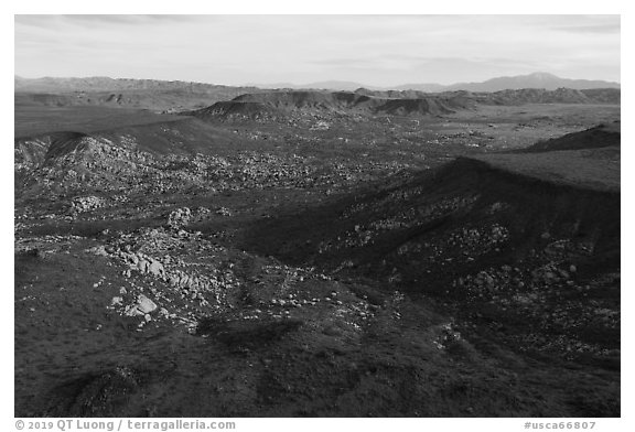 Aerial view of Black Lava Butte, boulders, and Flat Top Butte. Sand to Snow National Monument, California, USA (black and white)