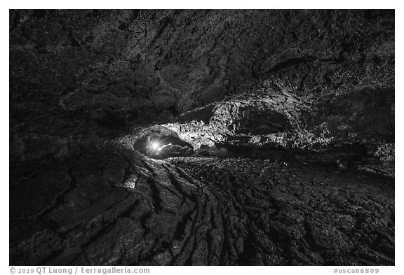 Caver in Golden Dome Cave. Lava Beds National Monument, California, USA (black and white)