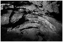 Inside lava tube cave entrance, Lavic Lake volcanic field. Mojave Trails National Monument, California, USA ( black and white)