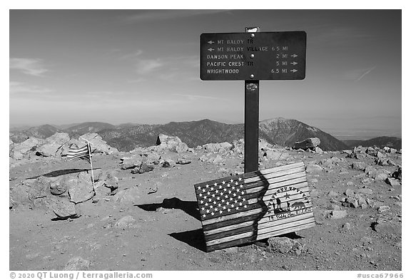 Sign and flags on Mt Baldy summit. San Gabriel Mountains National Monument, California, USA (black and white)