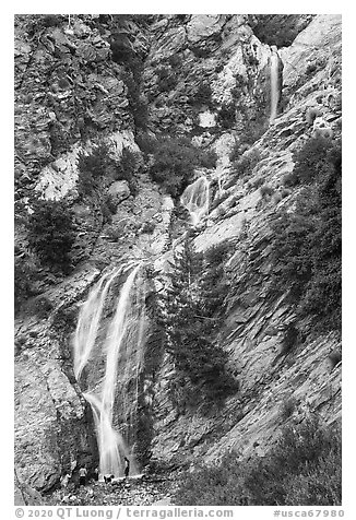 San Antonio Falls with family at the base. San Gabriel Mountains National Monument, California, USA (black and white)
