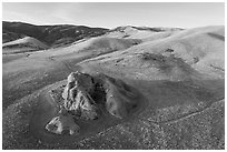 Aerial view of U-shaped rock outcrop named Painted Rock. Carrizo Plain National Monument, California, USA ( black and white)