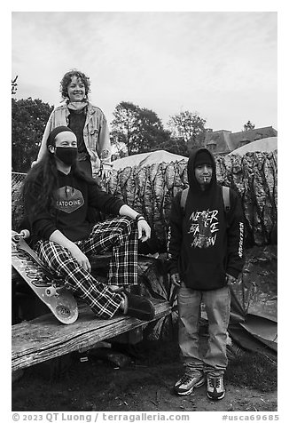 Volunteers posing with resident at Peoples Park. Berkeley, California, USA (black and white)