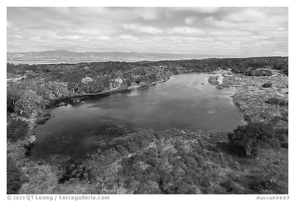 Aerial view of pond with Salinas Valley in the distance. California, USA