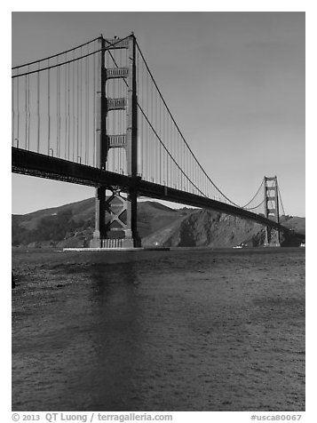 Golden Gate Bridge from water level, afternoon. San Francisco, California, USA (black and white)