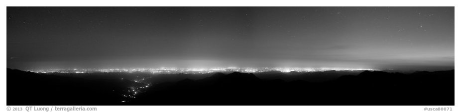Central Valley lights at dusk seen from Morro Rock. California, USA (black and white)