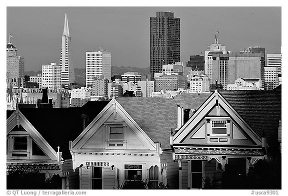 Victorians at Alamo Square and skyline, late afternoon. San Francisco, California, USA (black and white)