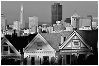 Victorians at Alamo Square and skyline, late afternoon. San Francisco, California, USA (black and white)