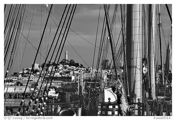 Telegraph Hill and Coit Tower seen through the masts of the Balclutha. San Francisco, California, USA