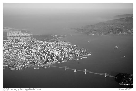 Aerial view of the Bay Bridge, the city, and  the Golden Gate Bridge. San Francisco, California, USA (black and white)