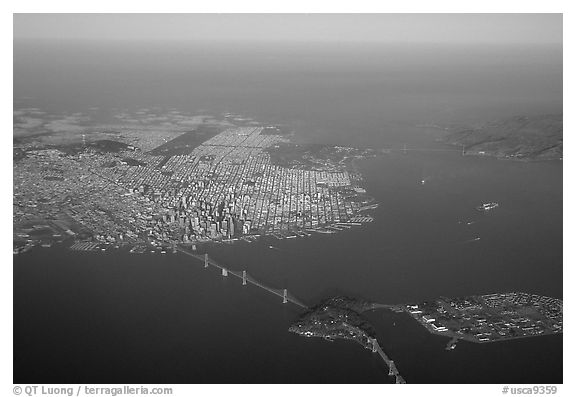 Aerial view of the Bay Bridge, the city, and  the Golden Gate Bridge. San Francisco, California, USA (black and white)