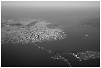 Aerial view of the Bay Bridge, the city, and  the Golden Gate Bridge. San Francisco, California, USA ( black and white)