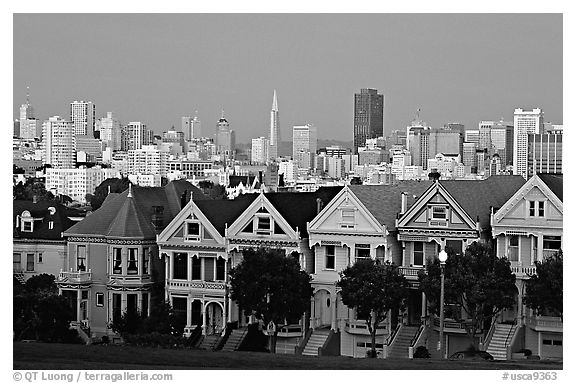 Victorians at Alamo Square and skyline, dusk. San Francisco, California, USA (black and white)