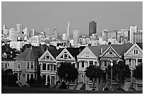 Victorians at Alamo Square and skyline, dusk. San Francisco, California, USA (black and white)