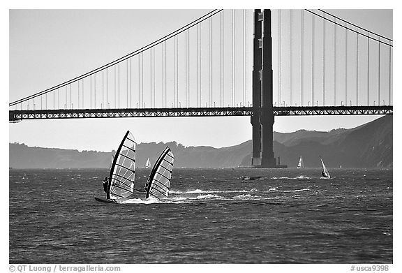 Windsurfers at Crissy Field, with the Golden Gate Bridge behind. San Francisco, California, USA (black and white)