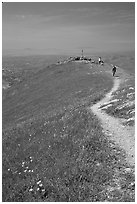 Hiker on trail at the summit of Mission Peak, Mission Peak Regional Park. California, USA (black and white)