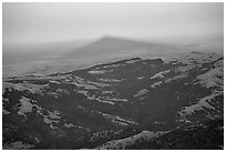 Shadow of Mt Diable projects far into the Central Valley at sunset, Mt Diablo State Park. California, USA (black and white)