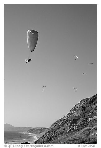 Paragliding above a sea cliff, the Dumps, Pacifica. San Mateo County, California, USA (black and white)