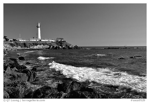 Wave and Pigeon Point Lighthouse, afternoon. San Mateo County, California, USA (black and white)