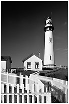 Fence and Pigeon Point Lighthouse, afternoon. San Mateo County, California, USA (black and white)