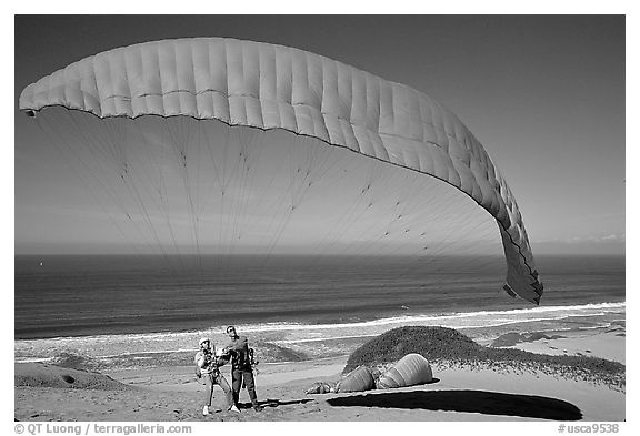 Paragliders practising in sand dunes, Marina. California, USA (black and white)