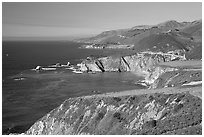 Distant view of Bixby Creek Bridge and coast, afternoon. Big Sur, California, USA (black and white)