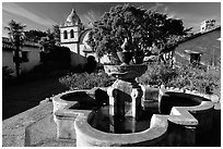 Fountain and chapel, Carmel Mission. Carmel-by-the-Sea, California, USA (black and white)