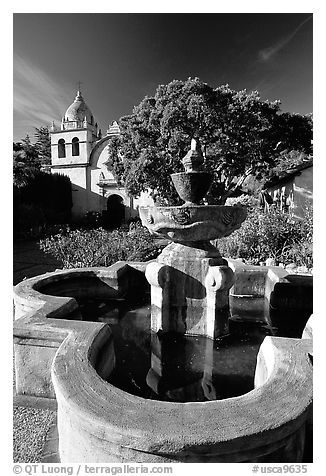 Fountain and chapel, Carmel Mission. Carmel-by-the-Sea, California, USA (black and white)