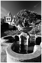 Fountain and chapel, Carmel Mission. Carmel-by-the-Sea, California, USA (black and white)