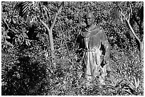 Statues of the father in the garden, Carmel Mission. Carmel-by-the-Sea, California, USA ( black and white)