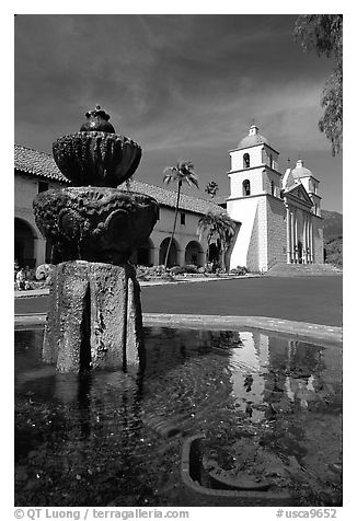 Fountain and Mission Santa Babara, mid-day. Santa Barbara, California, USA (black and white)