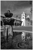 Fountain and Mission Santa Babara, mid-day. Santa Barbara, California, USA (black and white)