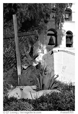 Cross, statue of father, belltower, Mission San Diego de Alcala. San Diego, California, USA