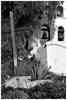 Cross, statue of father, belltower, Mission San Diego de Alcala. San Diego, California, USA ( black and white)