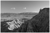 Visitor surveying panorama at Font Point. Anza Borrego Desert State Park, California, USA (black and white)