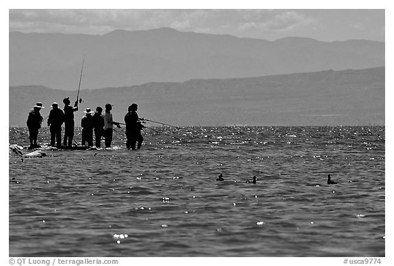 Fishermen on the shore of Salton Sea. California, USA (black and white)