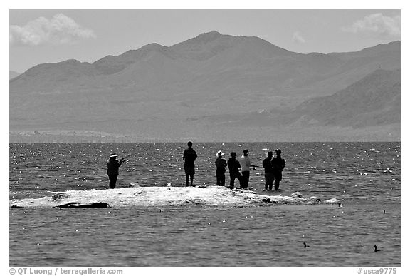 Fishermen on the shore of Salton Sea. California, USA (black and white)