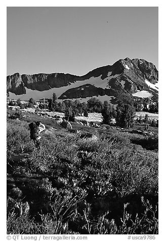 Hiker on trail towards Round Top, late afternoon. Mokelumne Wilderness, Eldorado National Forest, California, USA