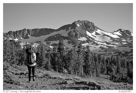 Backpacker  on trail towards Round Top. Mokelumne Wilderness, Eldorado National Forest, California, USA