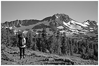 Backpacker  on trail towards Round Top. Mokelumne Wilderness, Eldorado National Forest, California, USA (black and white)